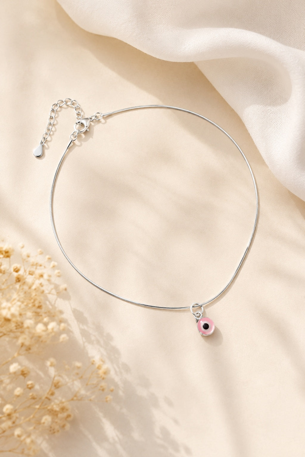 Silver pink evil eye anklet – minimal, stylish, and protective